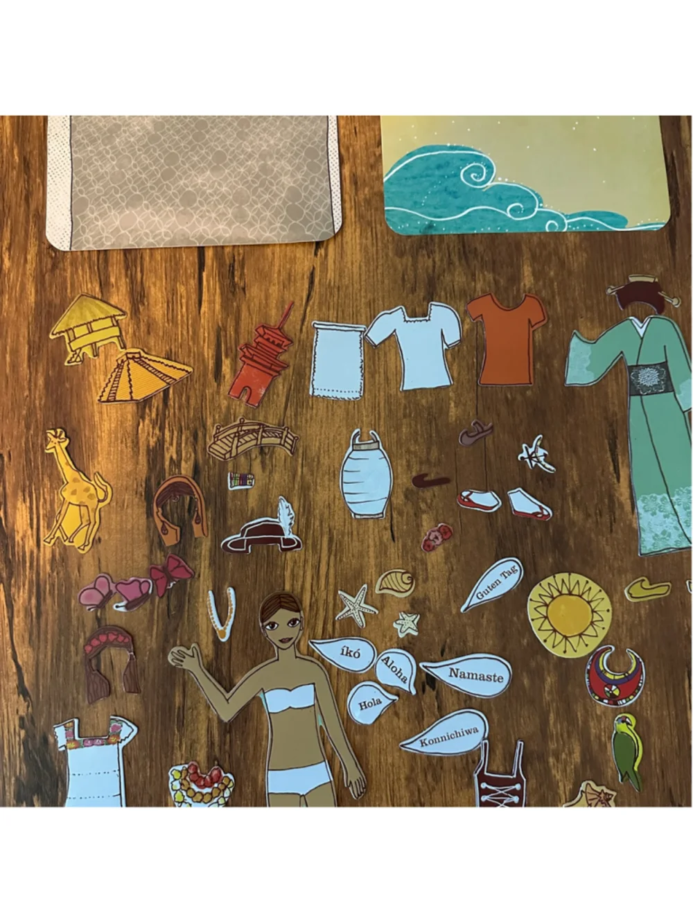 Mudpuppy World Traveler Magnetic Dress Up Doll Set Tin Clothing Accessories